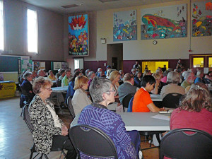 Attendees listen to a speaker at the Victoria stop of the KAIROS G20 Climate Justice Tour