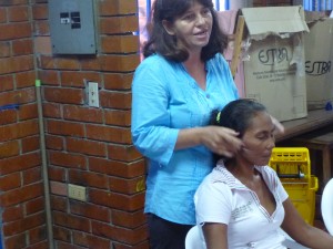 Gloria Suarez, OFP leader, offers demonstrates chakra points and offers flower essenses to reduce fear and anxiety