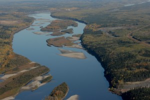 The Athabasca River flows north through the boreal forest north of Fort MacMurray.