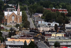 Workers begin digging at the site of a derailment in Lac Megantic Quebec