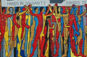 Solidarity Mural from the United Electrical Workers building in Chicago.  Photo: Terence Faircloth, 2006,  Creative Commons License. https://flic.kr/p/evbxT
