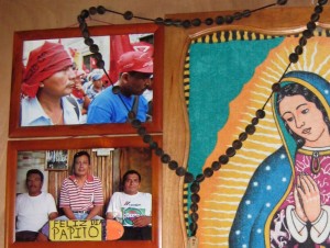 A photo in memory of Adolfo Ich, with the caption 'Happy Father's Day', hangs on the wall of his family home in El Estor.