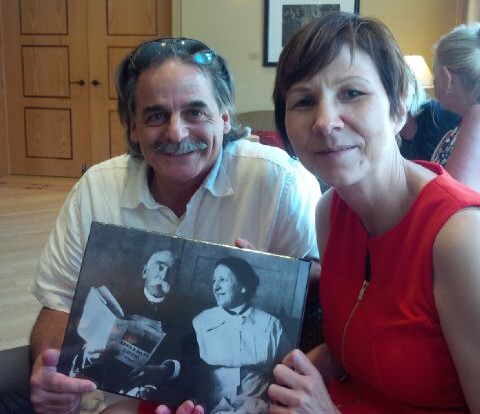Program Manager Ed Bianchi and KAIROS partner, Dr. Cindy Blackstock, hold a photograph of Peter Henderson Bryce and his wife at a gathering held to unveil a plaque in his honor. Photo by Valerie Galley