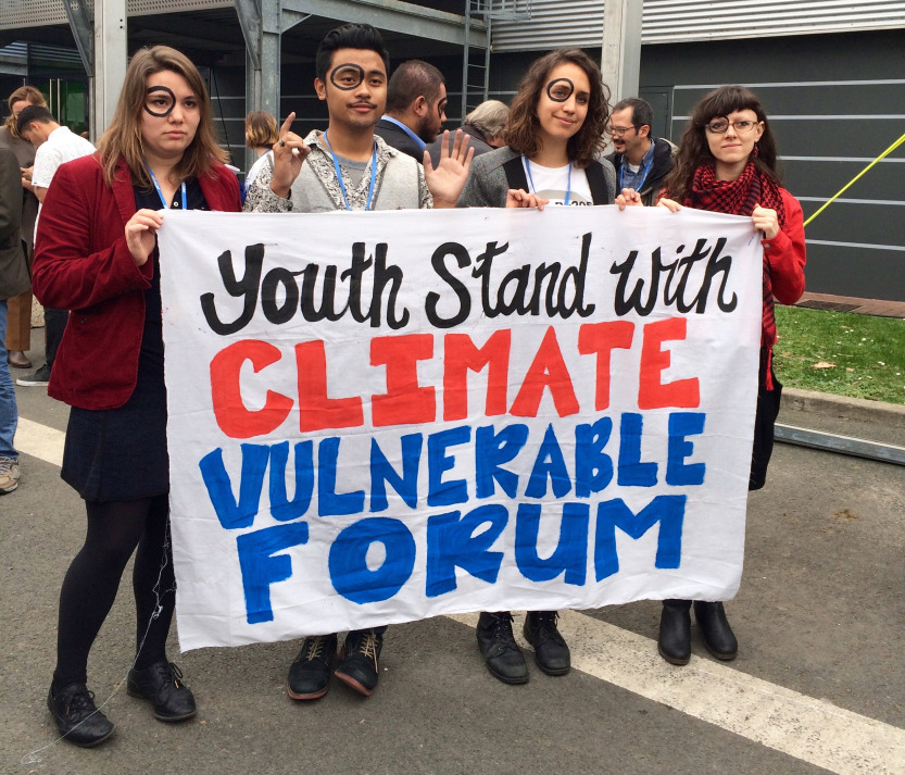 Youth activists supporting climate-vulnerable regions at COP21.