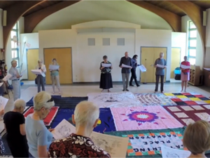 Participants partake in the Blanket Exercise, a workshop that delves into the effects of colonization. Photo by KAIROS Canada