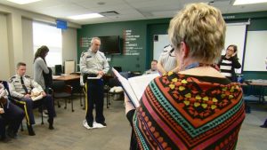 RCMP members from Alberta take part in the Kairos Blanket Exercise in Cochrane. (Laurent Pirot/CBC)