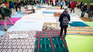 In the blanket exercise, blankets represent land belonging to Indigenous people prior to contact. As the game goes on, the blankets become smaller, with large distances between them.