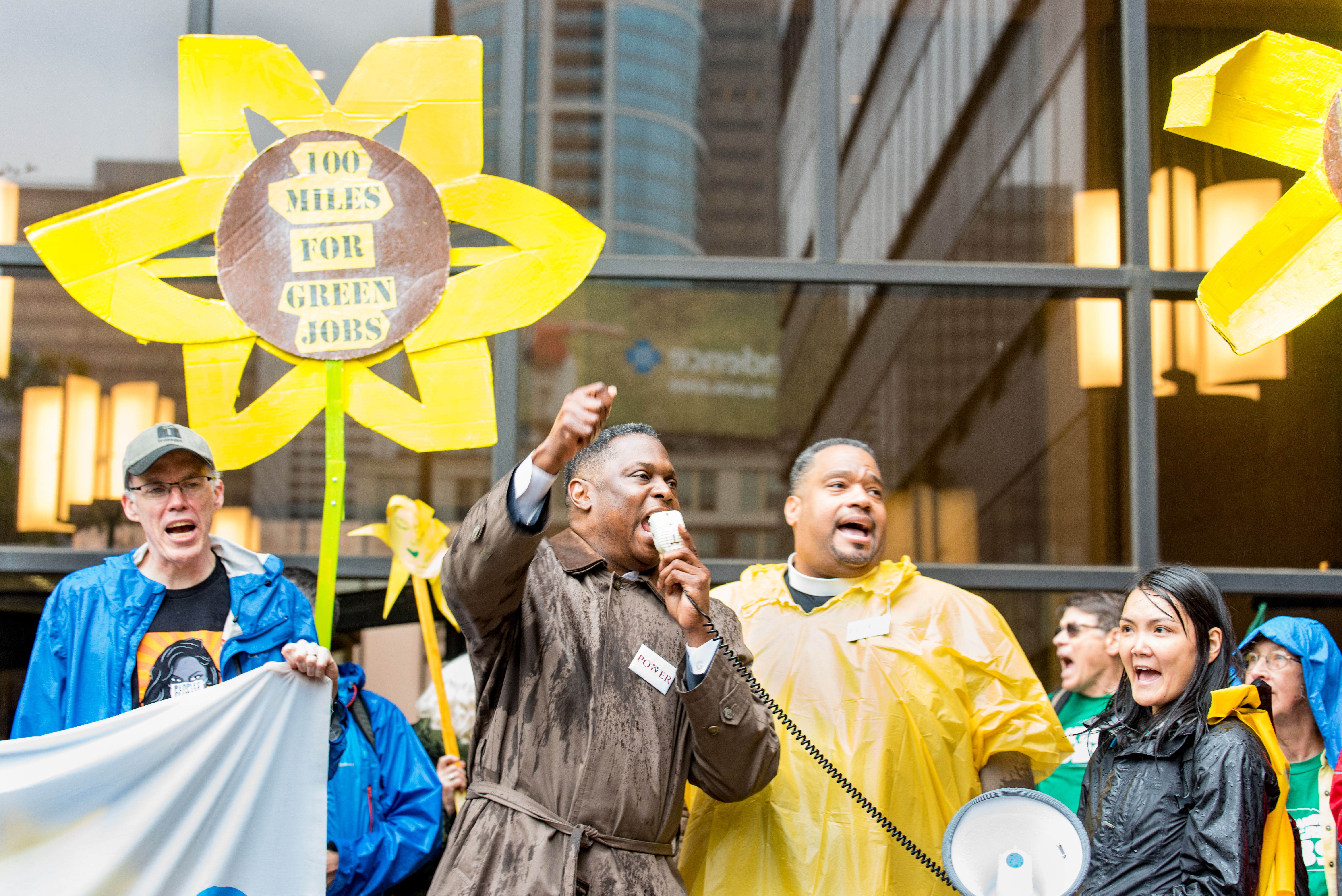 Climate activist Bill McKibben, Rev. Gregory Holston of POWER, and Bishop Dwayne Royster of People Improving Communities through Organizing, at the end of the 100-mile walk for Green Jobs and Justice. Photo by Chris Baker Evens