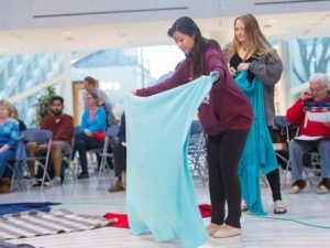 Student volunteers prepare for a Kairos Blanket Exercise at Edmonton City Hall in 2016. The Exercise was created as an interactive way of learning Indigenous history.