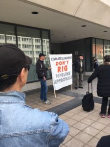 protest sign: 'Climate leaders don't rig pipelines.'