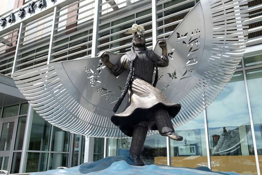 A life-sized bronze monument honouring missing and murdered indigenous women and girls near the main entrance of Saskatoon police headquarters. Created by artist Lionel Peyachew, the sculpture depicts Red Star Woman, a fancy dancer with her shawl as wings