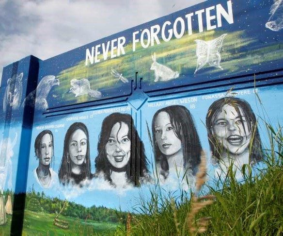 MURAL ARTIST TOM ANDRICH’S PUBLIC ART IN HONOUR OF MMIW, LOCATED ON THE PORTAGE AVE. AND EMPRESS ST. OVERPASS IN WINNIPEG.