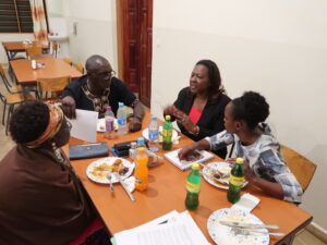 Agnes & Fr. James of SSCC, Jeannette & Monica of FECCLAHA, are discussing WPS program narrative reporting issues at dinner during the ENSS in late January 2020