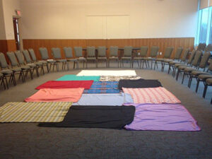 KAIROS blanket exercise circle with empty chairs