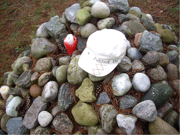 On September 4, 2011, Mabel Todd placed her Walk4Justice cap on the cairn at Maryholme, Keswick, close to the shore of Lake Simcoe.