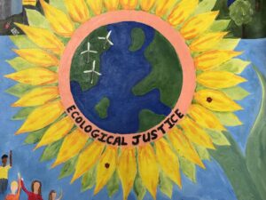 Poster of a large sunflower with small people and images around the edge with ecological justice messages
