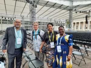 Four individuals. From left to right - Zoughbi Zoughbi of Wiam Palestinian Conflict Transformation Centre in Palestine, Reverend Paul Gehrs, Aisha Francis, KAIROS Executive Director and Jackcilia Salathiel, the National Women’s Coordinator at the South Sudan Council of Churches.