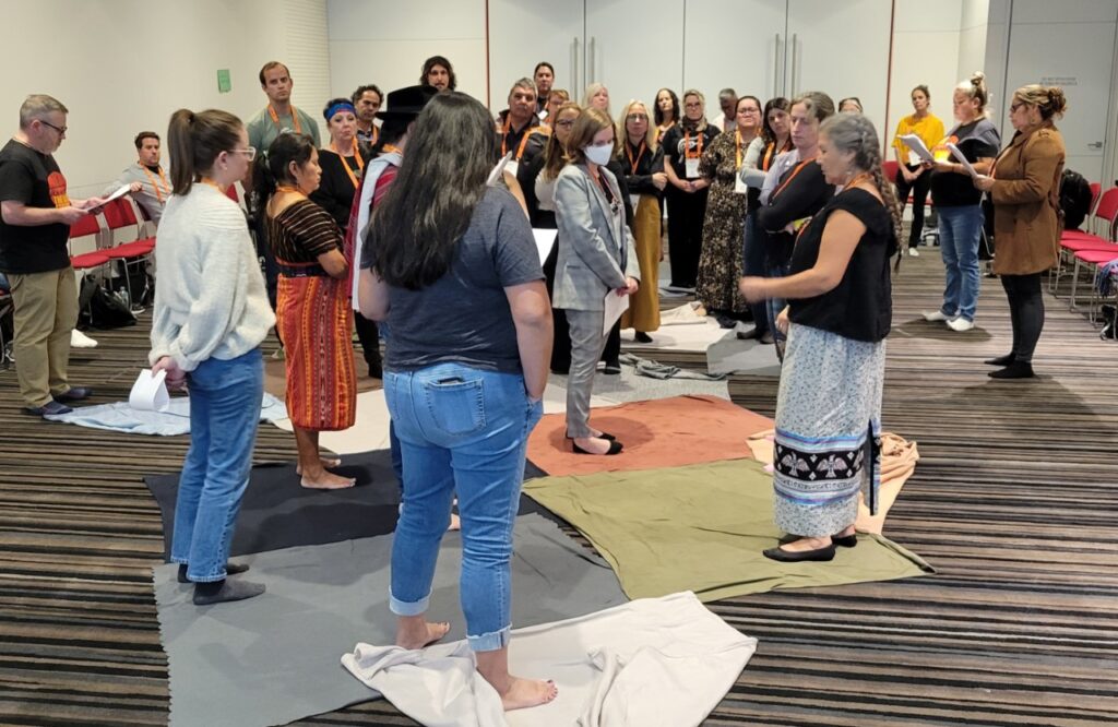 Image of the KAIROS Blanket Exercise in action. People standing on blankets.