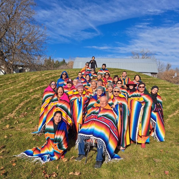 60s Scoop Gathering participants posing for a group photo