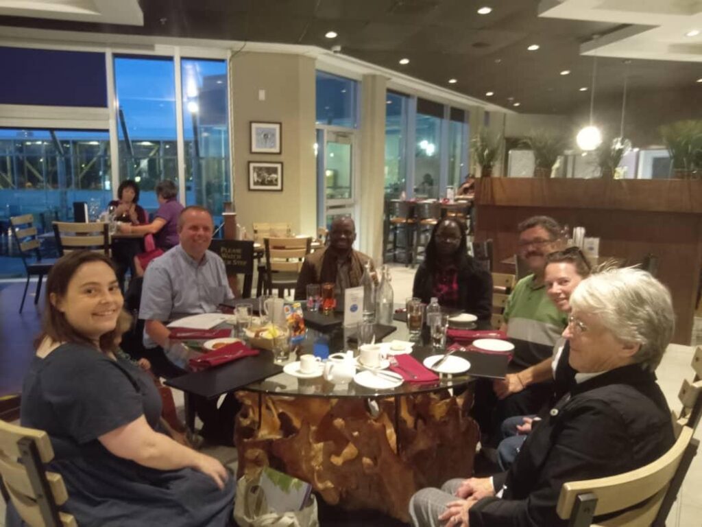 Alison, Tom, and Gérard with Proscovia Mungasa James, South Sudan Council of Churches, KAIROS staff members Rick Garland and Nathalie Boyer, and a community member during the Climate, Conflict Gender: KAIROS Canada’s Women of Courage Visit 2023.